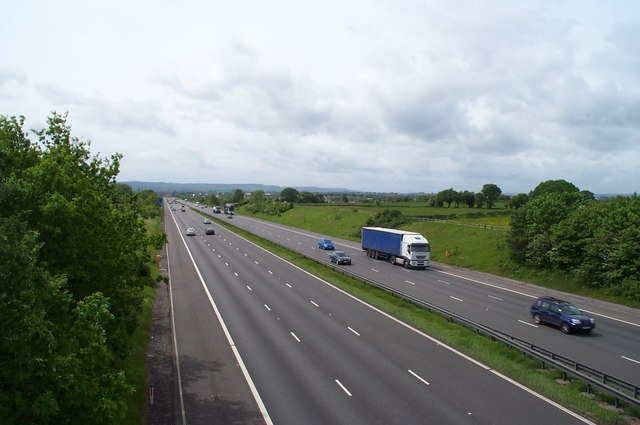 Crashed vehicles ambulances police roadblocks responding to reported incident in M40, Indiana